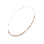 Rose gold necklace with clear lab grown diamonds on a white background