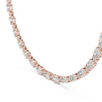Rose gold necklace with lab grown diamonds on a white background