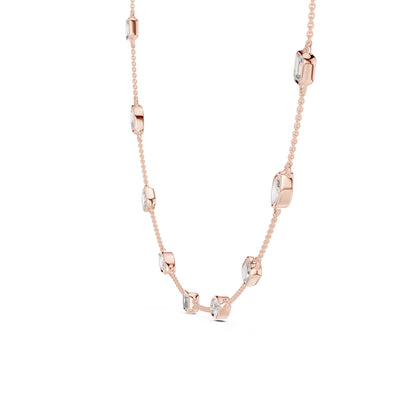 Rose gold necklace with lab grown diamonds on a white background