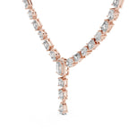 Rose gold necklace with lab grown diamonds on a white background