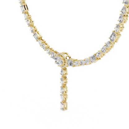 Gold necklace with lab grown diamond accents on a white background