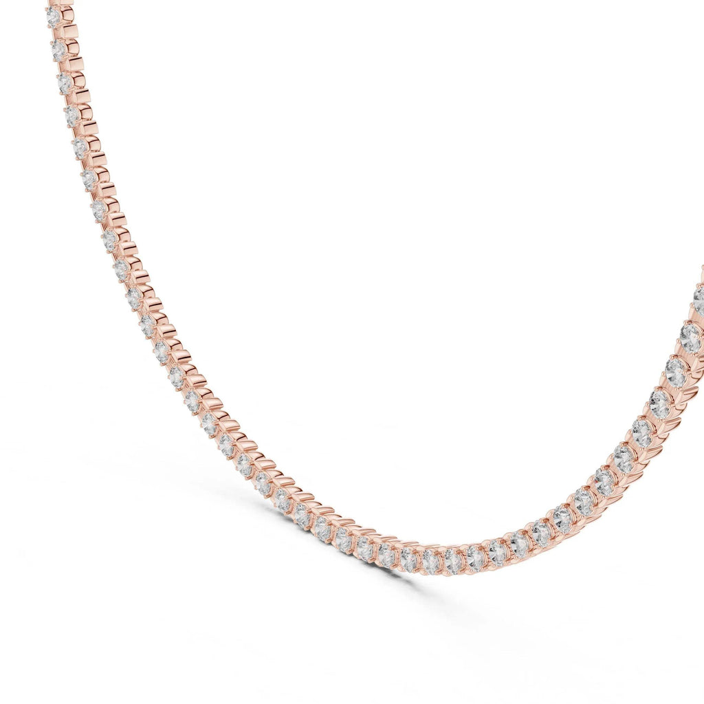 Rose gold necklace with lab grown diamonds on a white background