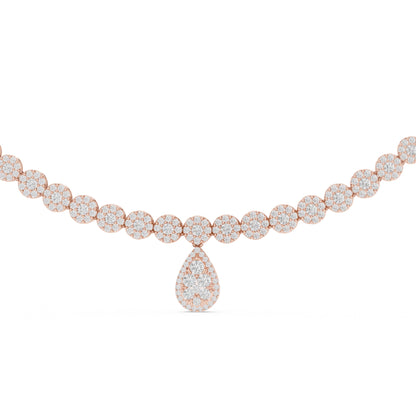 Rose gold tennis necklace with diamond teardrop pendant on a white background