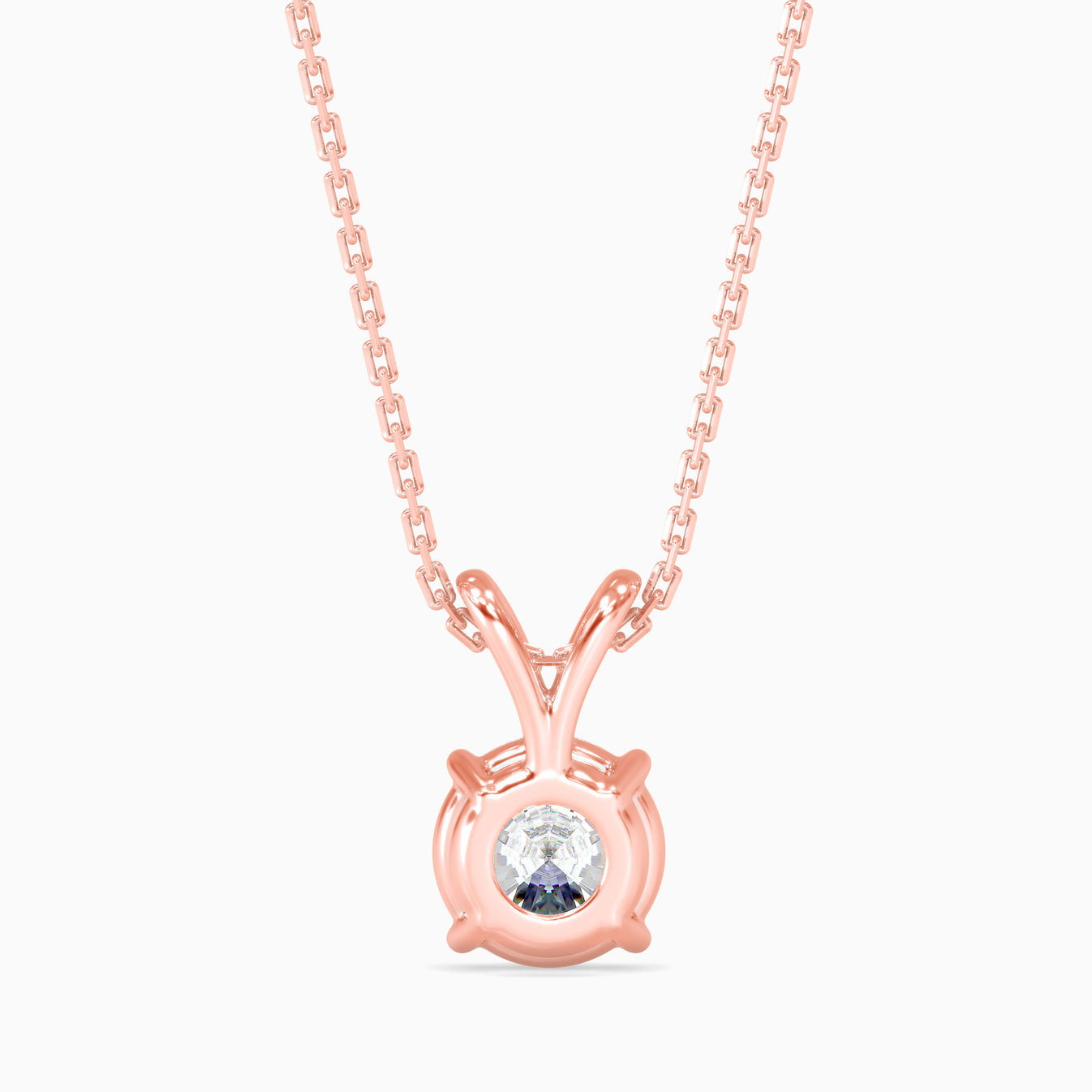 Rose gold necklace with a round lab grown diamond pendant on a white background