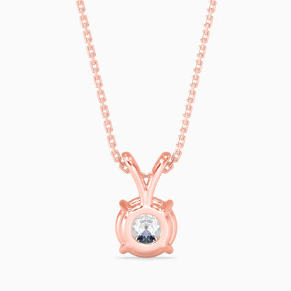Rose gold necklace with a round lab grown diamond pendant on a white background