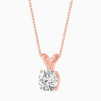 Rose gold necklace with a solitaire lab grown diamond pendant on a white background.