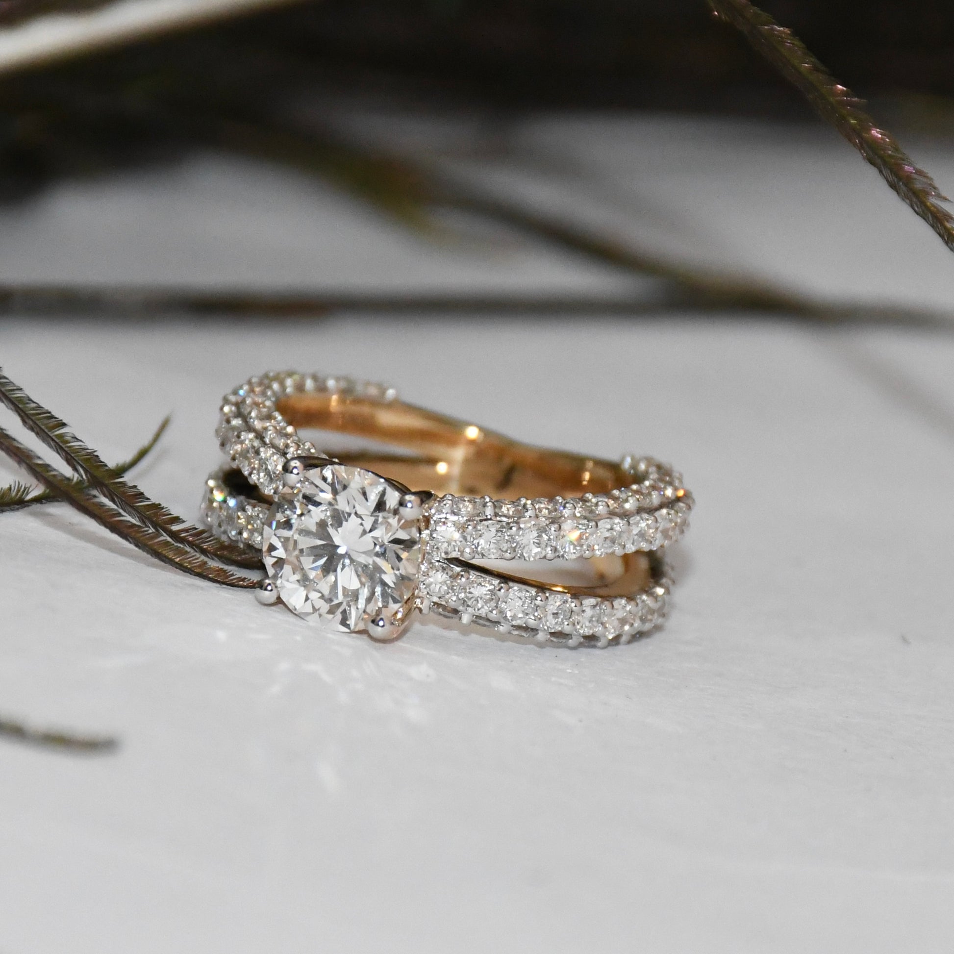 Lab grown diamond ring on a light surface with blurred background