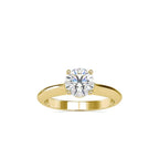Gold ring with a solitaire lab grown diamond on a white background