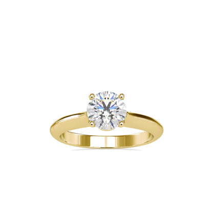 Gold ring with a solitaire lab grown diamond on a white background