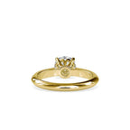 Gold ring with a solitaire lab grown diamond on a white background