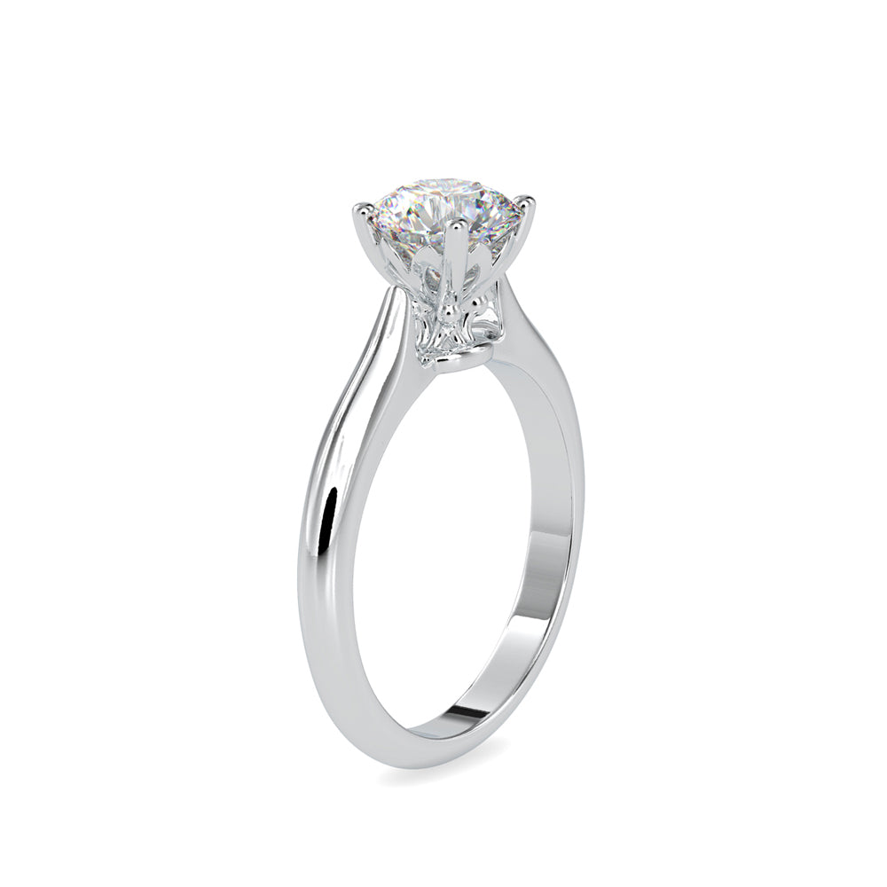 Gold ring with a solitaire lab grown diamond on a white background