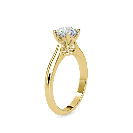 Gold ring with a solitaire lab grown diamond on a white background