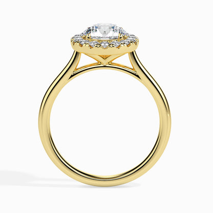 Gold ring featuring a round brilliant-cut lab grown diamond at the center, surrounded by a sparkling halo of smaller round diamonds, displayed on a light background.