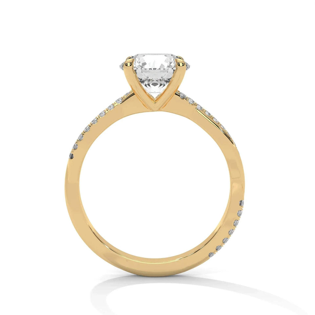 Gold and lab grown diamond ring on a white background.
