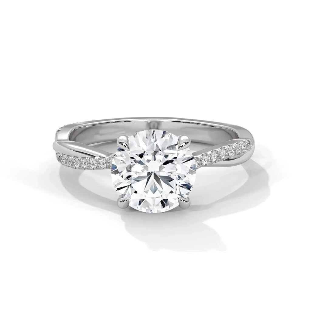 Gold and lab grown diamond ring on a white background.