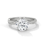Gold and lab grown diamond ring on a white background.