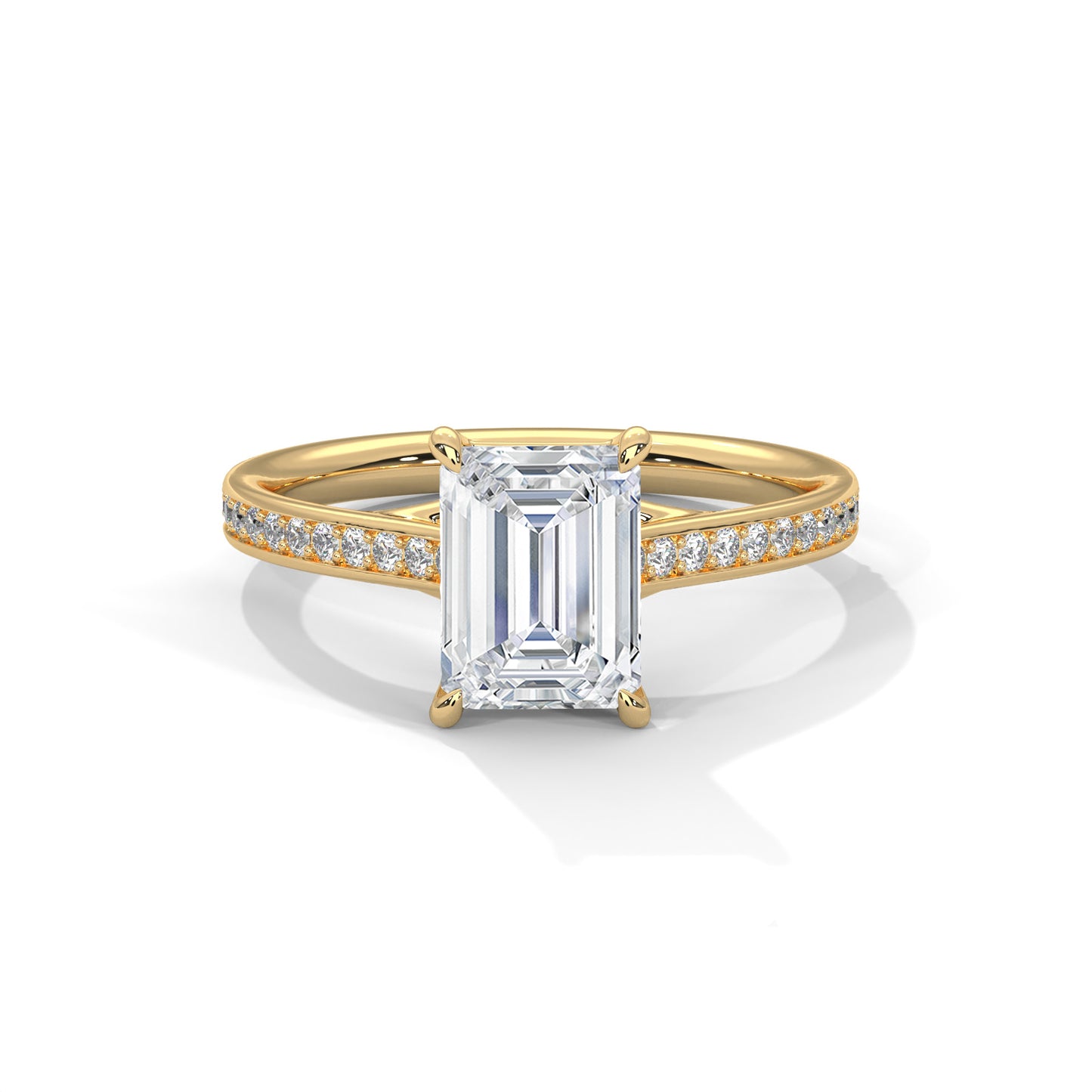 Gold ring with a large baguette-cut diamond and smaller diamonds on the band against a white background