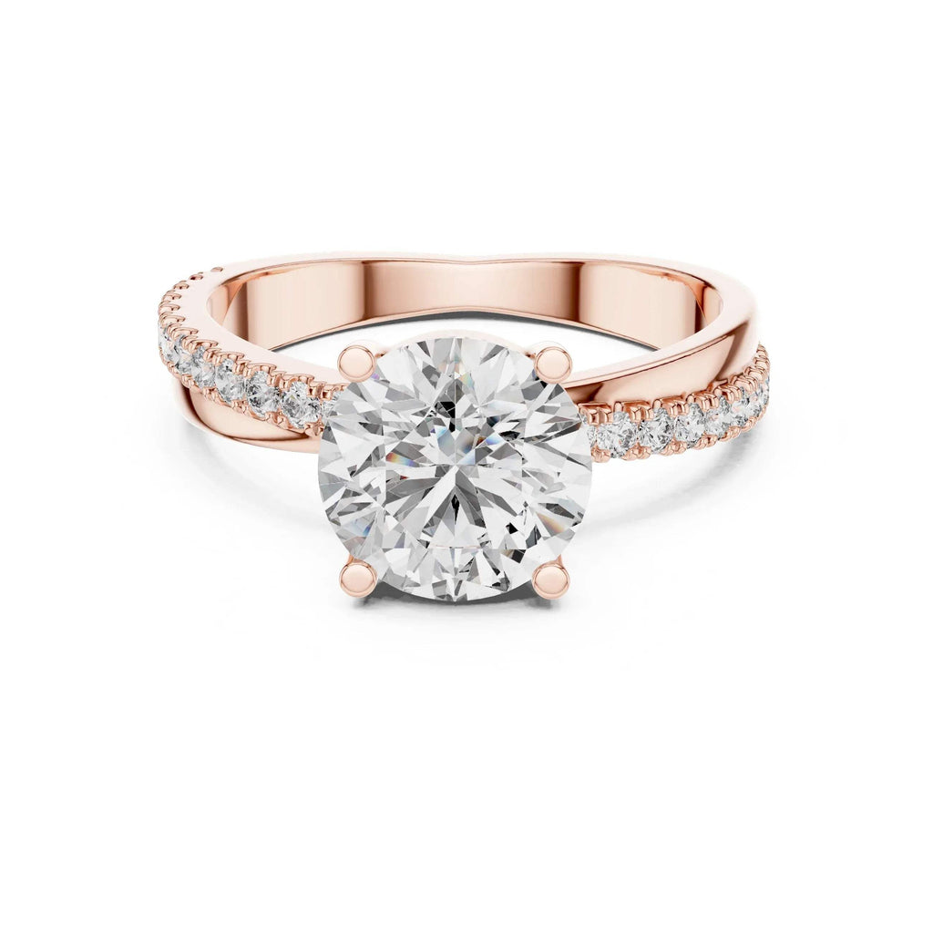 Rose gold ring with a large lab grown diamond and smaller lab grown diamonds on the band against a white background