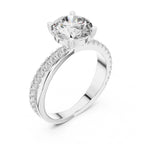 Lab grown diamond ring with a white gold band on a white background