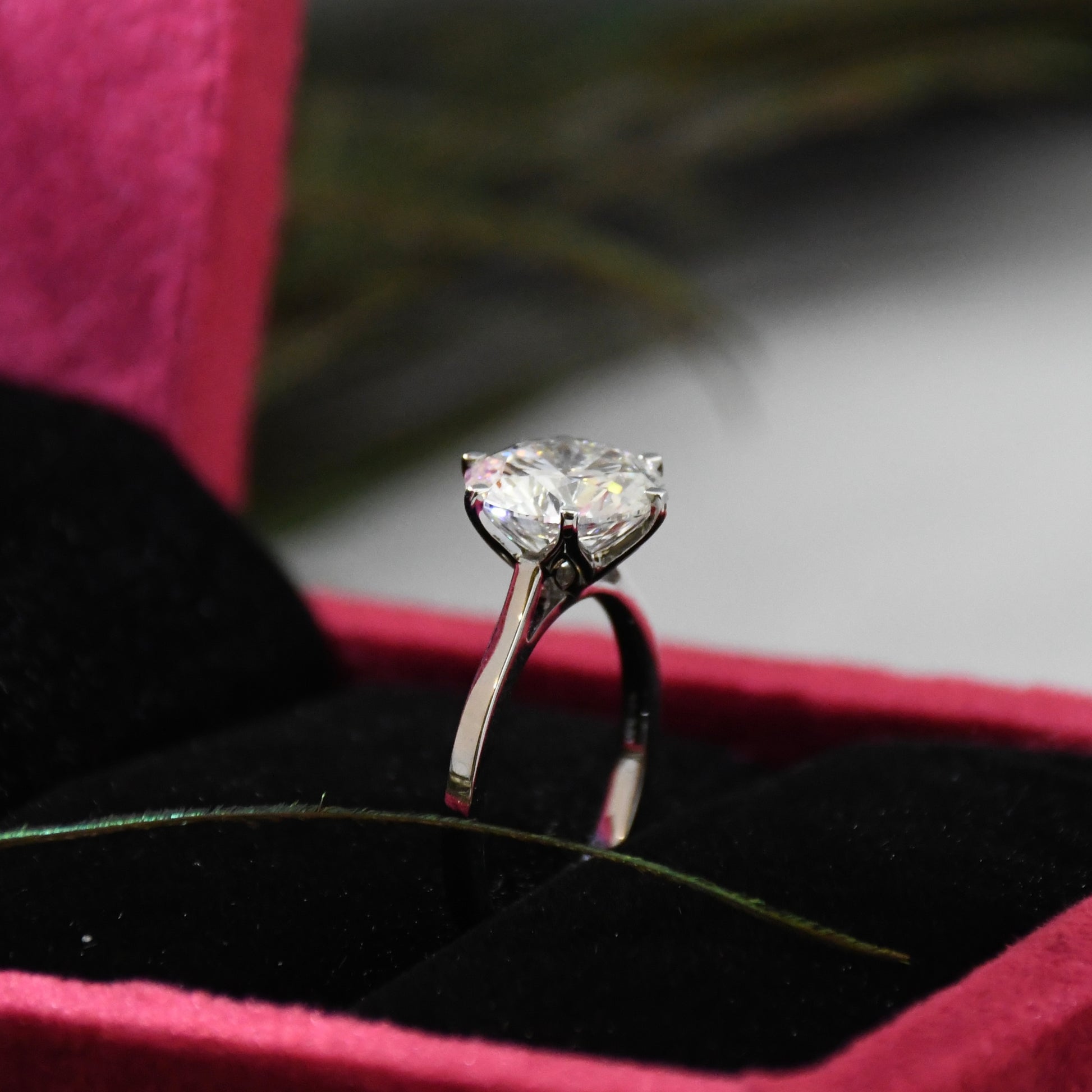 Diamond ring in a red box with a blurred background