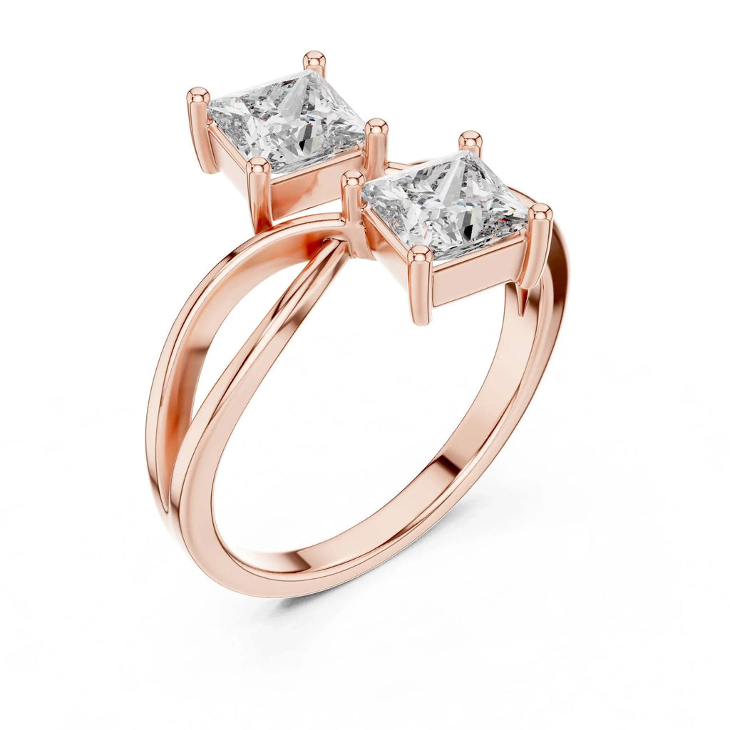 Rose gold ring with two princess-cut lab grown diamonds on a white background