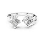 white gold ring with two princess-cut lab grown diamonds on a white background