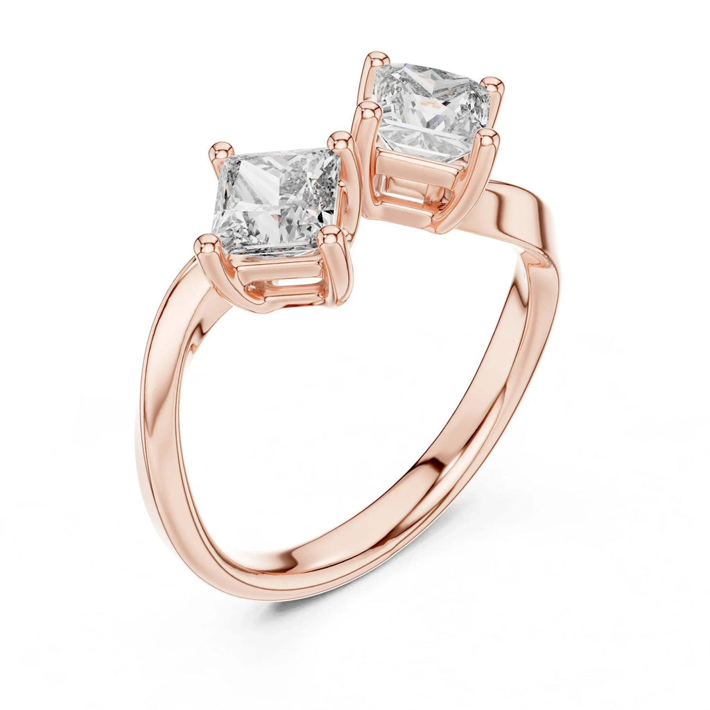 Rose gold ring with two princess-cut lab grown diamonds on a white background