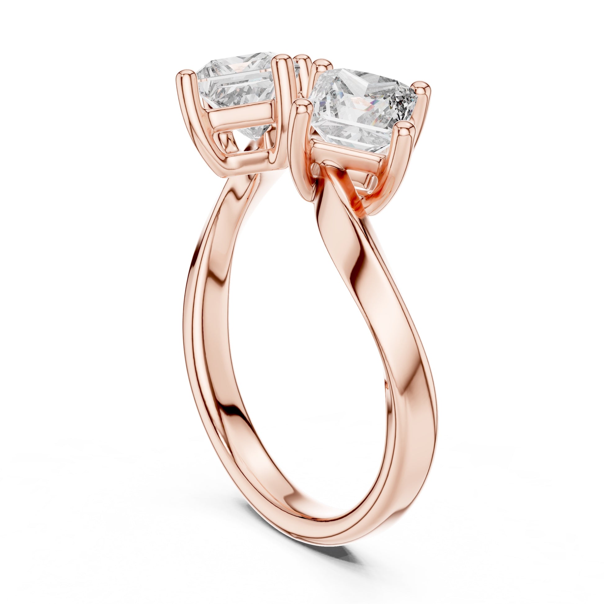 Rose gold ring with two large lab grown diamonds on a white background