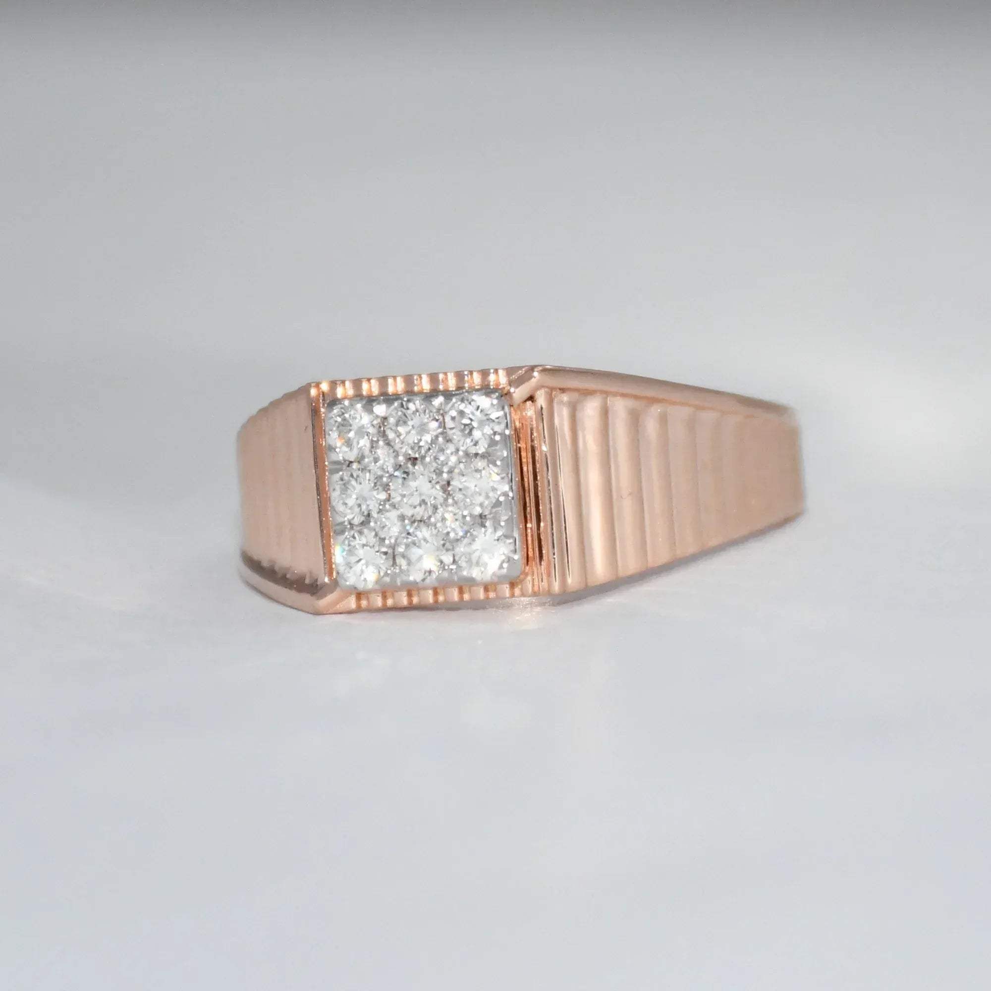 gold ring with diamond on a gray background
