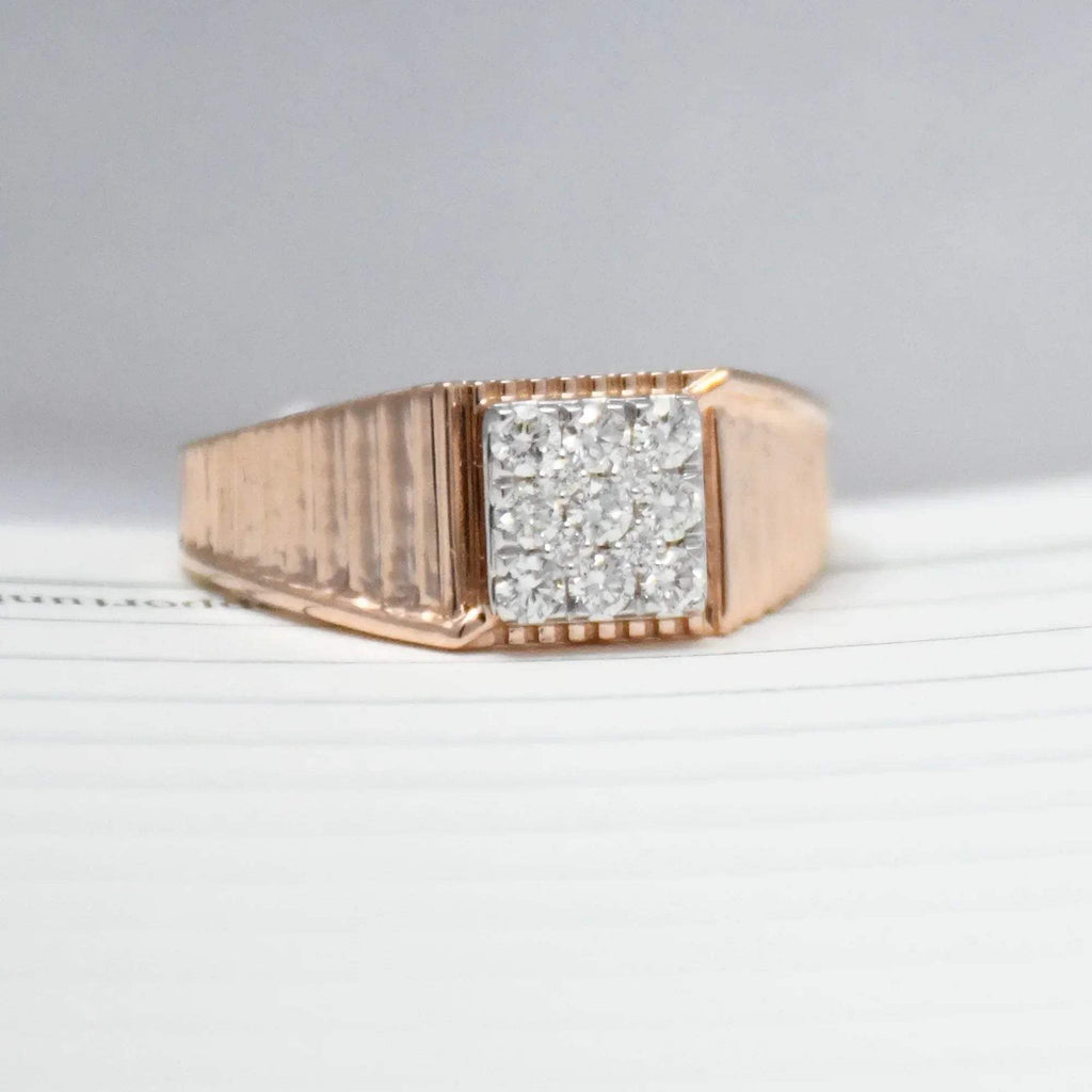 gold ring with diamonds on a light gray background
