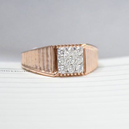 gold ring with diamonds on a light gray background