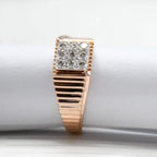 gold ring with diamond accents on a white surface
