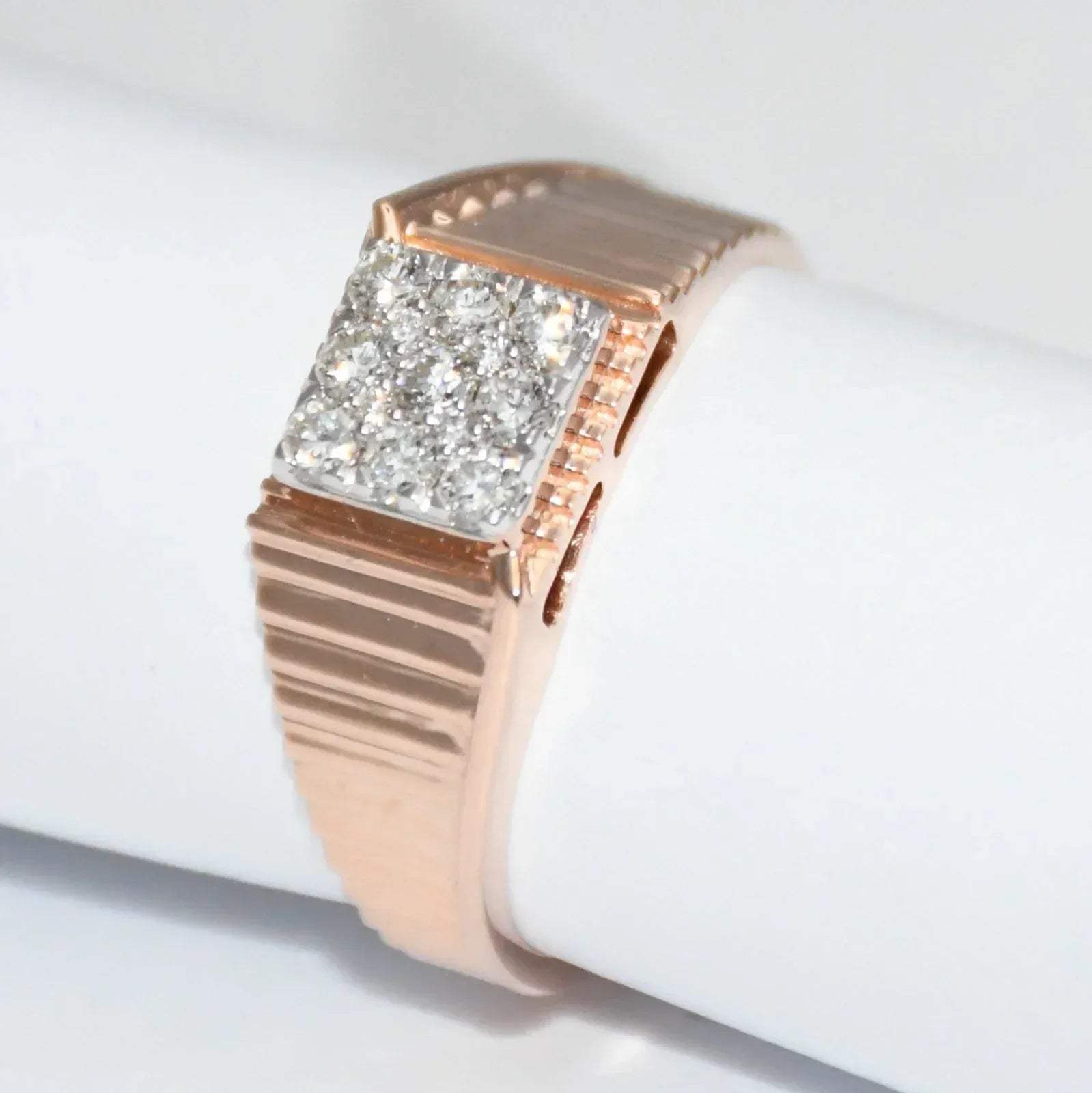 gold ring with diamond accents on a white background