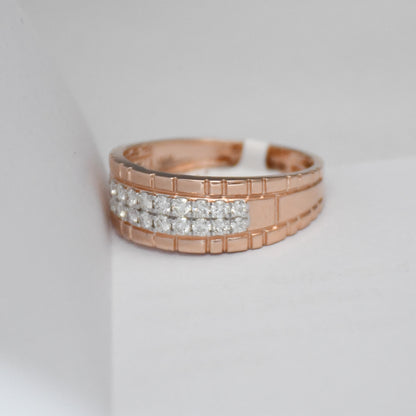 gold ring with diamond accents on a light gray background