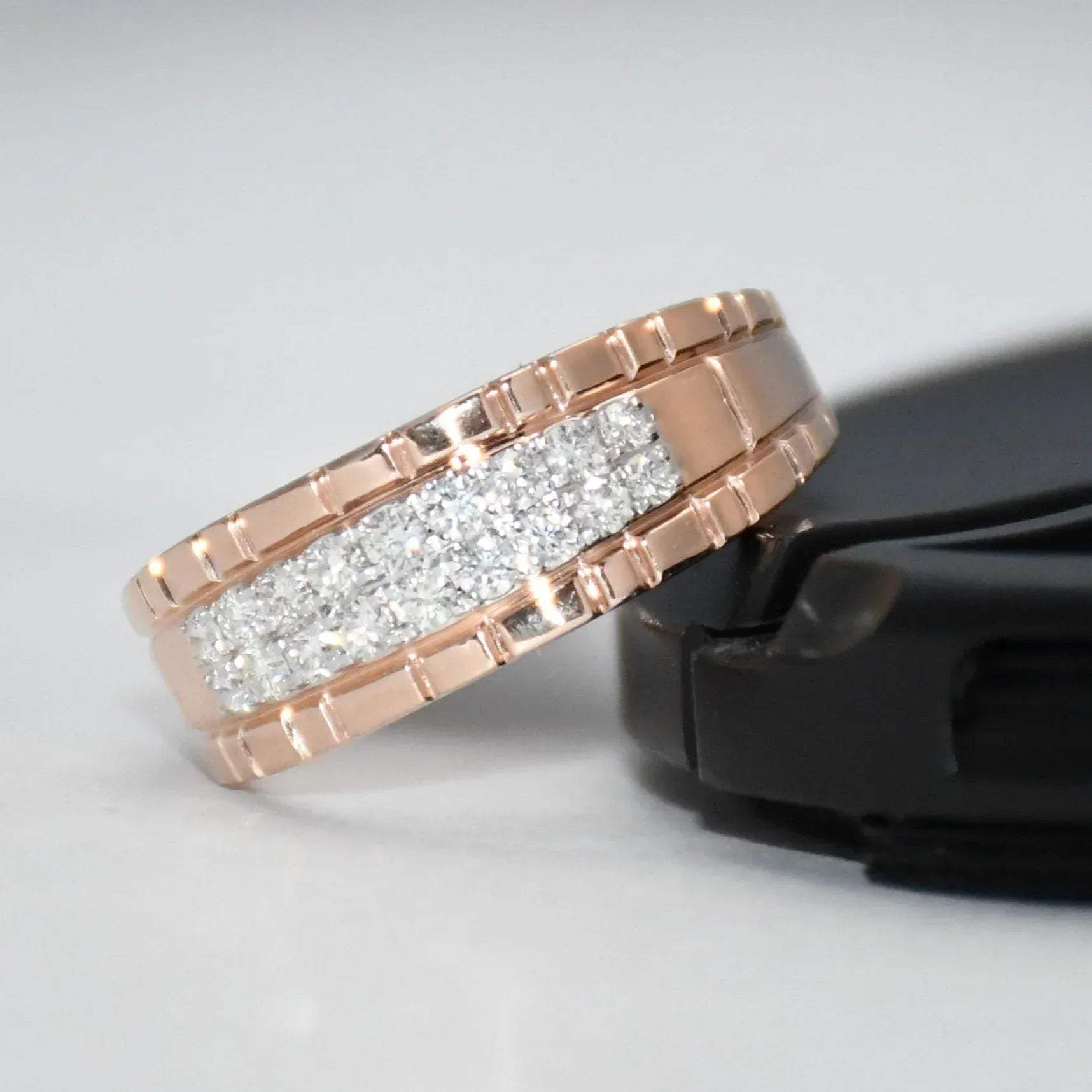 gold ring with diamonds on a gray background