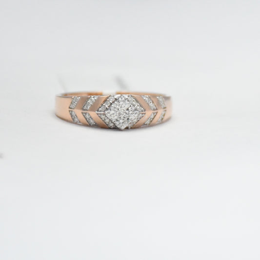 gold ring with diamond accents on a light gray background