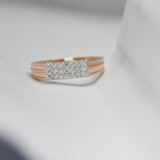 Rose gold rings with diamond accents on a light gray background