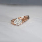 gold ring with diamond hexagonal design on a light gray background