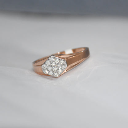 gold ring with diamond hexagonal design on a light gray background