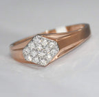 gold ring with a diamond on a light gray background