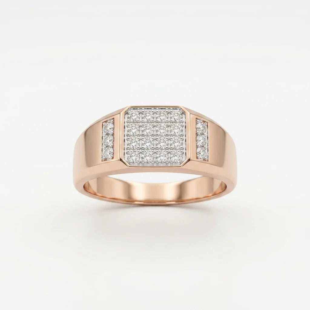A gold ring with a square pavé diamond center and a small side channel of diamonds, displayed on a white surface against a white background.