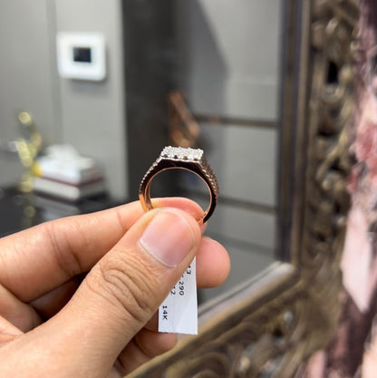 A man's hand displaying a cluster set diamonds ring made in gold.