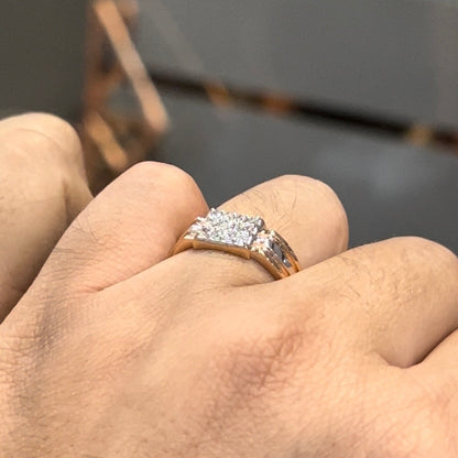 Men’s diamond ring in dual-tone gold with bold rectangular cluster of round diamonds at the center, flanked by sleek metal panels, shown worn on finger.