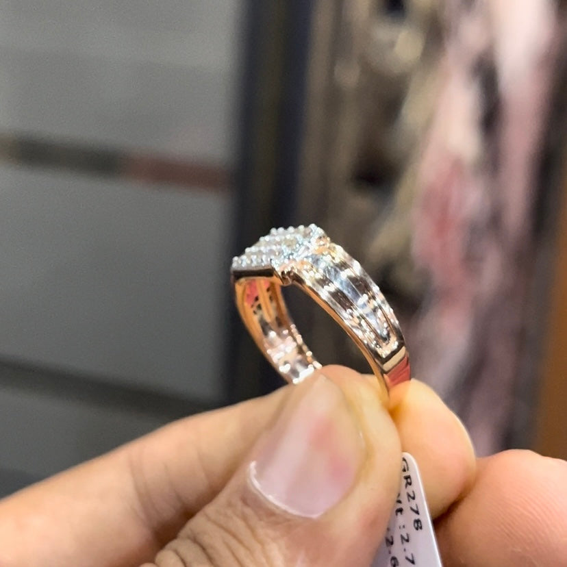 Close-up of gents diamond ring featuring rectangular diamond cluster centerpiece in rose and white gold band, reflecting strong masculine design.