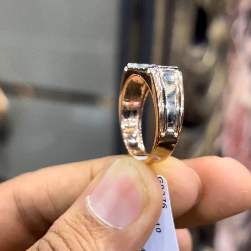 Men’s diamond ring in dual-tone gold with bold rectangular cluster of round diamonds at the center, flanked by sleek metal panels, shown worn on finger.