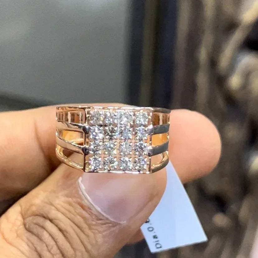 A man's hand holding a diamond ring with a solid gold band, featuring a clear diamond centerpiece.