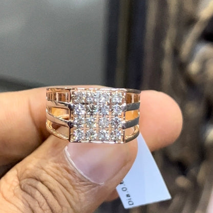 A man's hand holding a diamond ring with a solid gold band, featuring a clear diamond centerpiece.
