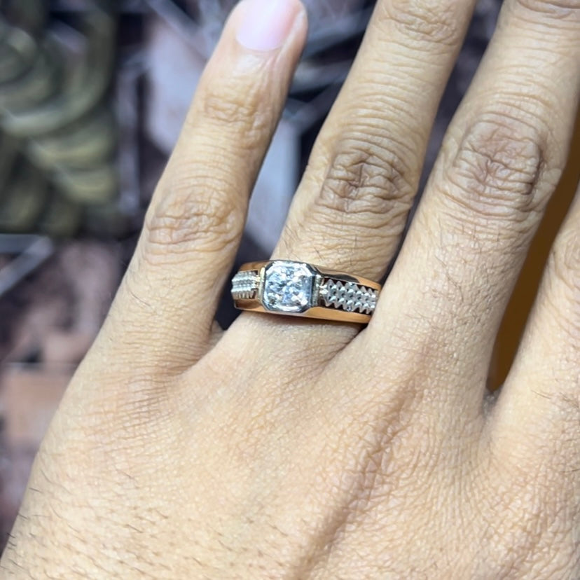 gold men's diamond ring with square solitaire and intricate lattice band detail shown on finger.