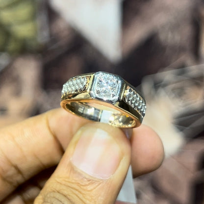 gold men's diamond ring with square solitaire and intricate lattice band detail shown on finger.