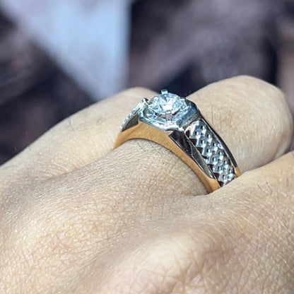 gold men's diamond ring with square solitaire and intricate lattice band detail shown on finger